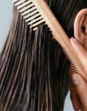 wooden comb representing hair care products 